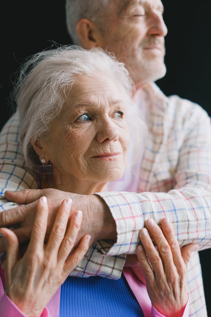 gallery-3 An elderly couple sharing a tender moment, symbolizing love and companionship.